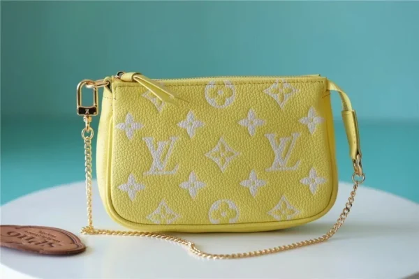 louis-vuitton-mini-pochette-accessoires-monogram-empreinte-leather-m46129