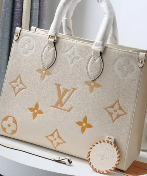 onthego-mm-monogram-empreinte-cream-m45717