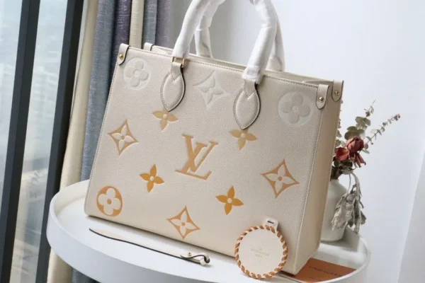 onthego-mm-monogram-empreinte-cream-m45717